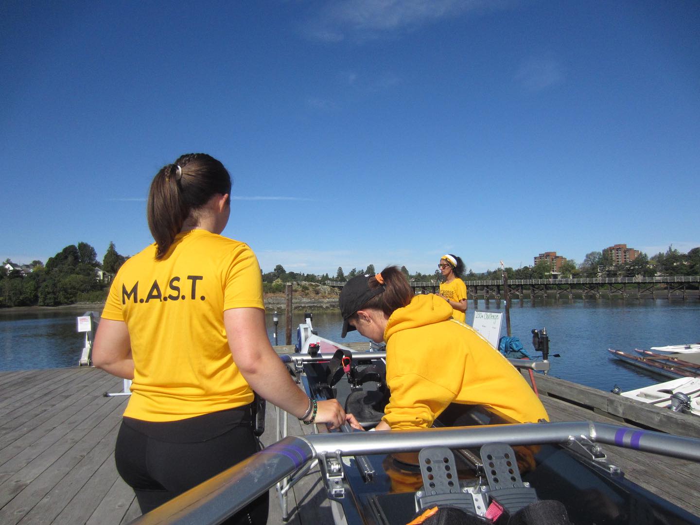 Two M.A.S.T. volunteers are working on a boat.