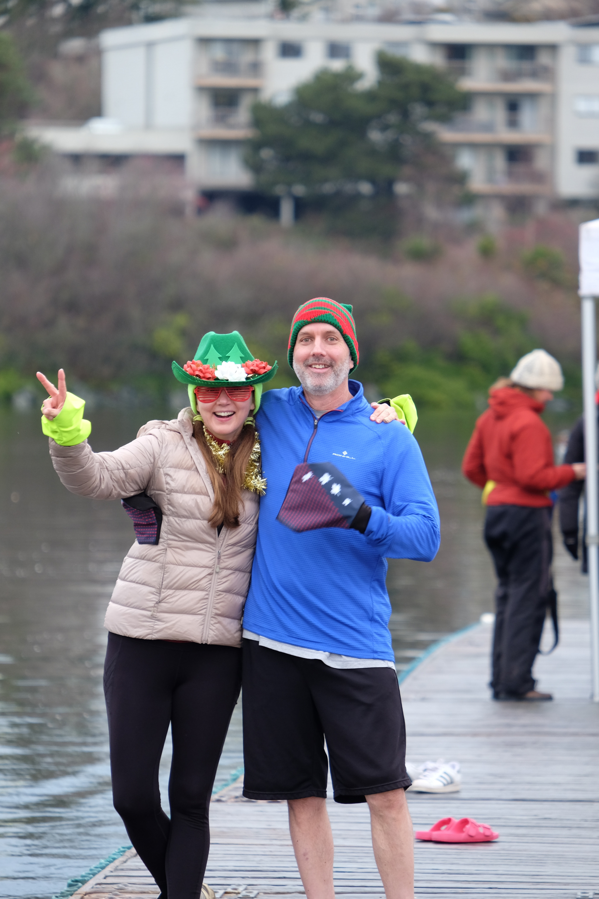 Two rowers posing on the dock.