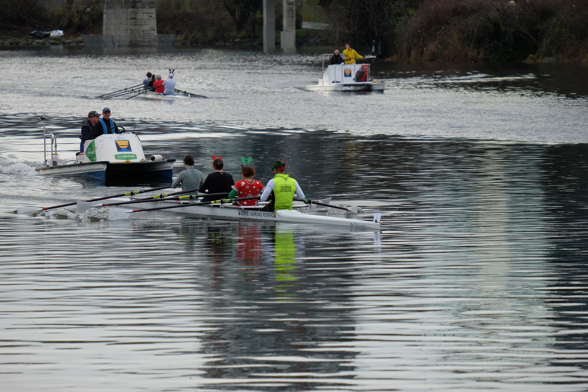 Two quads racing on the Gorge. Two coach boats are also visible.