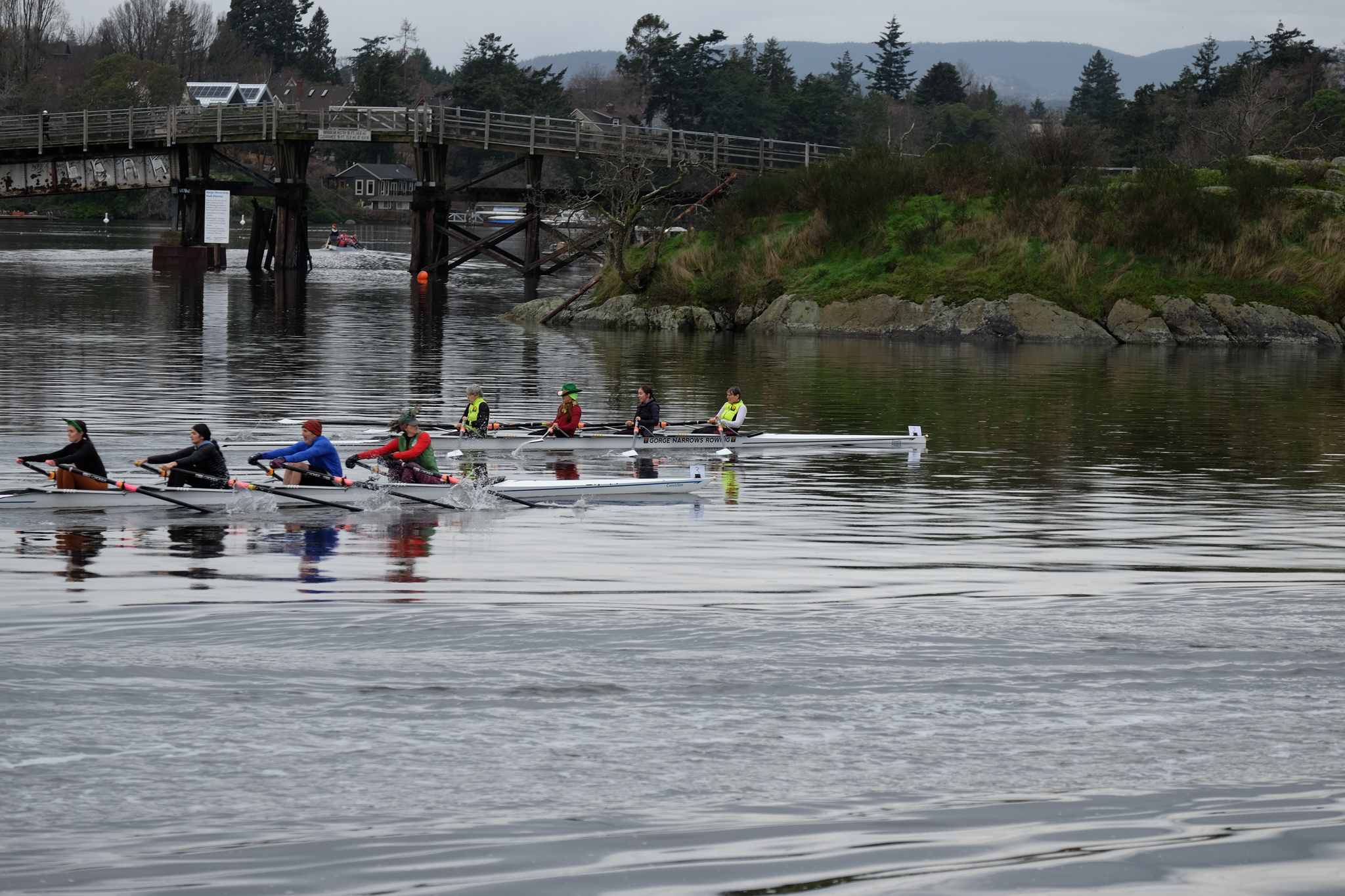 Two quads racing with the Selkirk Trestle in the background.