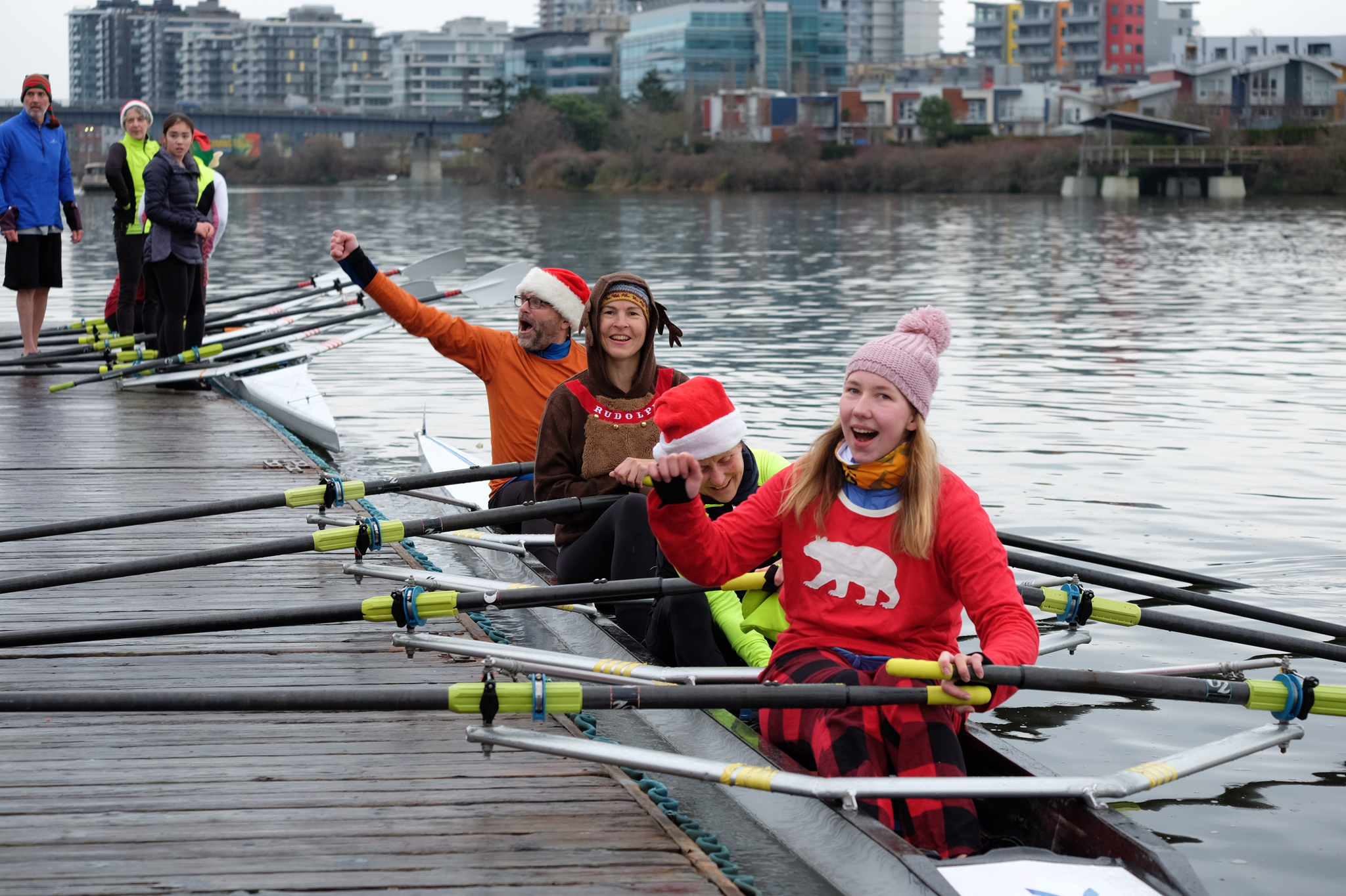 A quad docking. The rowers are cheering.