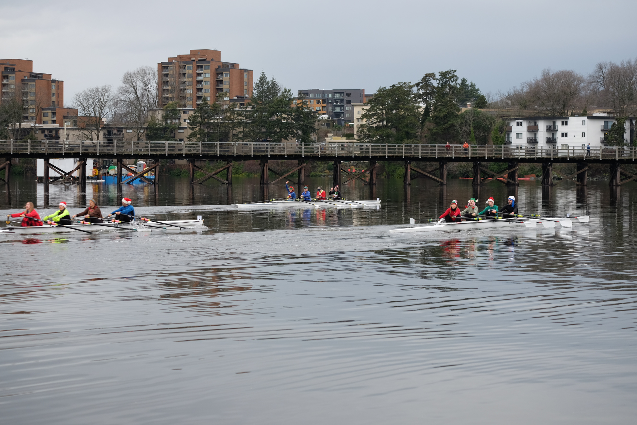 Two quads racing on the water. The Selkirk Trestle is in the background.