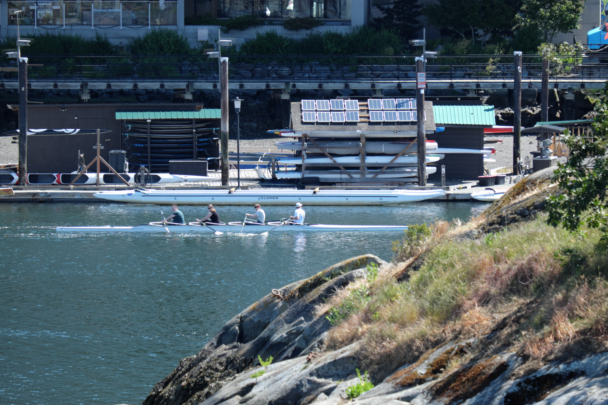 A boat on the water viewed from the Selkirk Trestle. On the lower right is Halkett (Deadman's) Island. 