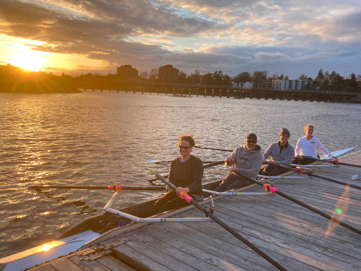 Adult rowers at the dock.