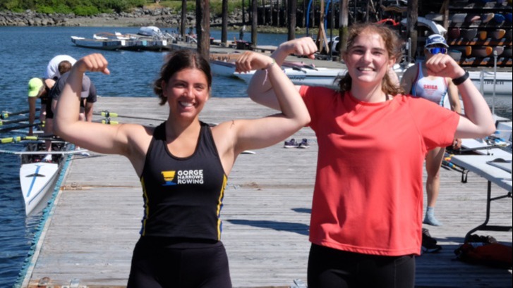 Two youth rowers on the dock.