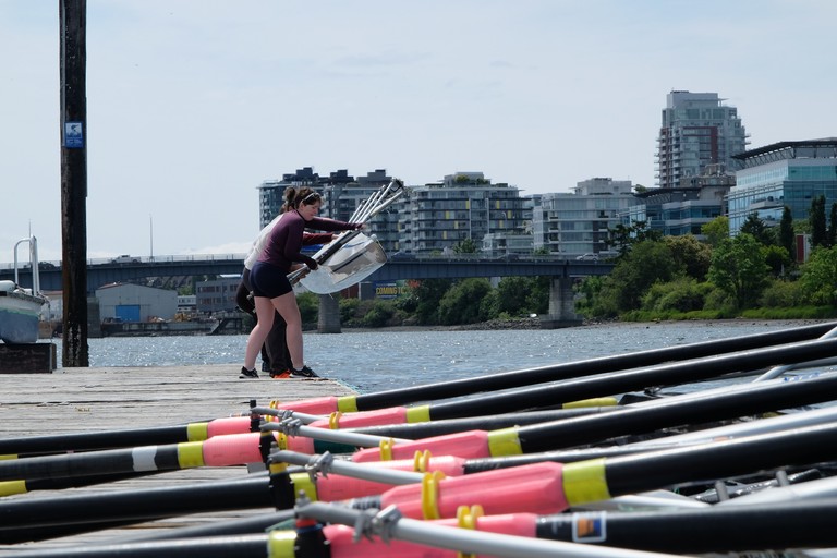 Placing a boat in the water.