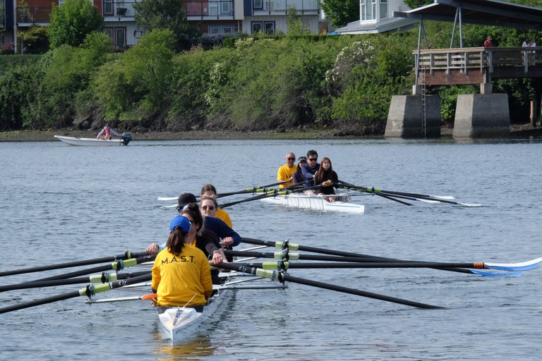 Two quads on the water. A coach boat is visible in the background.