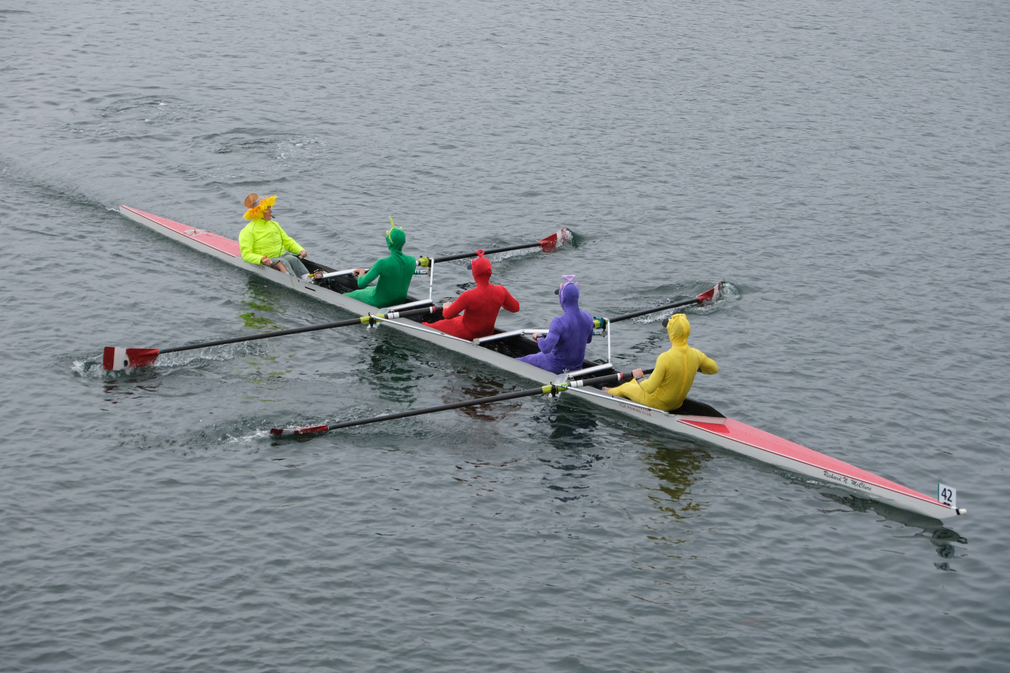 Four brightly coloured rowers approach the Selkirk Trestle in a coxed four on Saturday Morning.