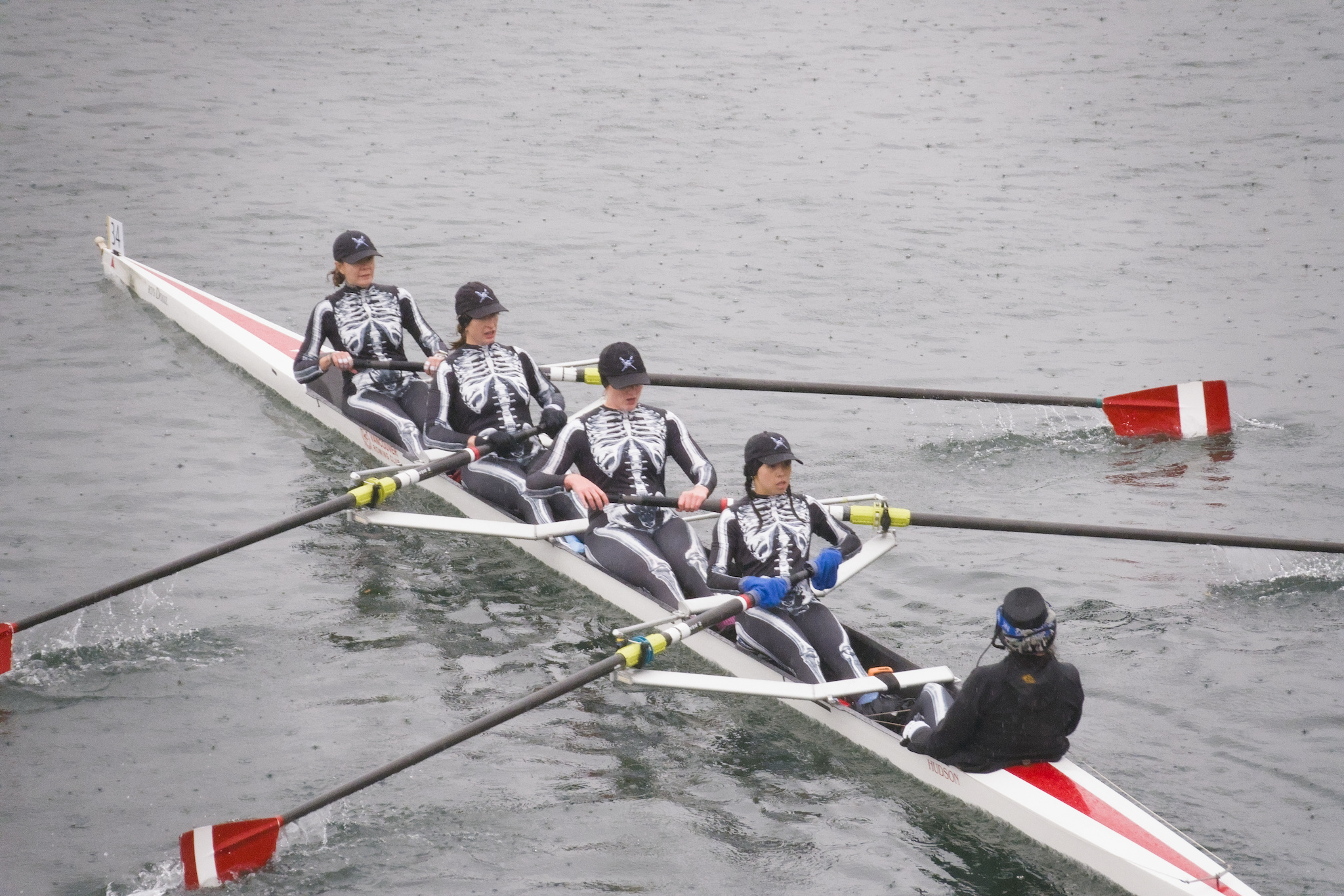 A coxed four with the rowers dressed as skeletons.