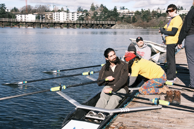 A quad at the dock. Volunteers and coaches are helping the participants get ready to launch.