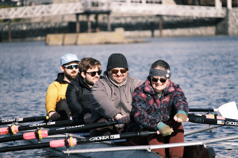 A close-up of four rowers in a quad.