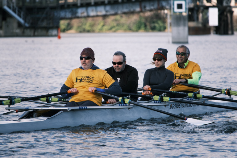 Another quad headed north. A navigation marker and the Selkirk Trestle are visible in the background.
