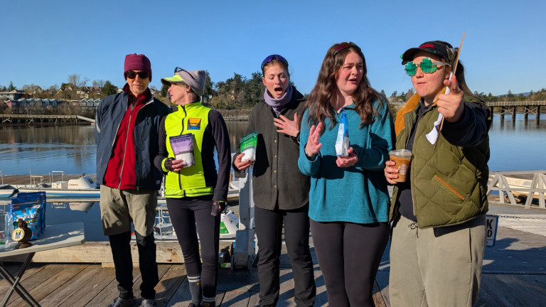 Another four rowers and a coach on the dock after receiving their prizes!