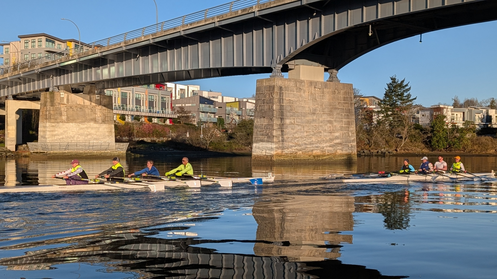 Two quads rowing under the Point Ellice bridge.