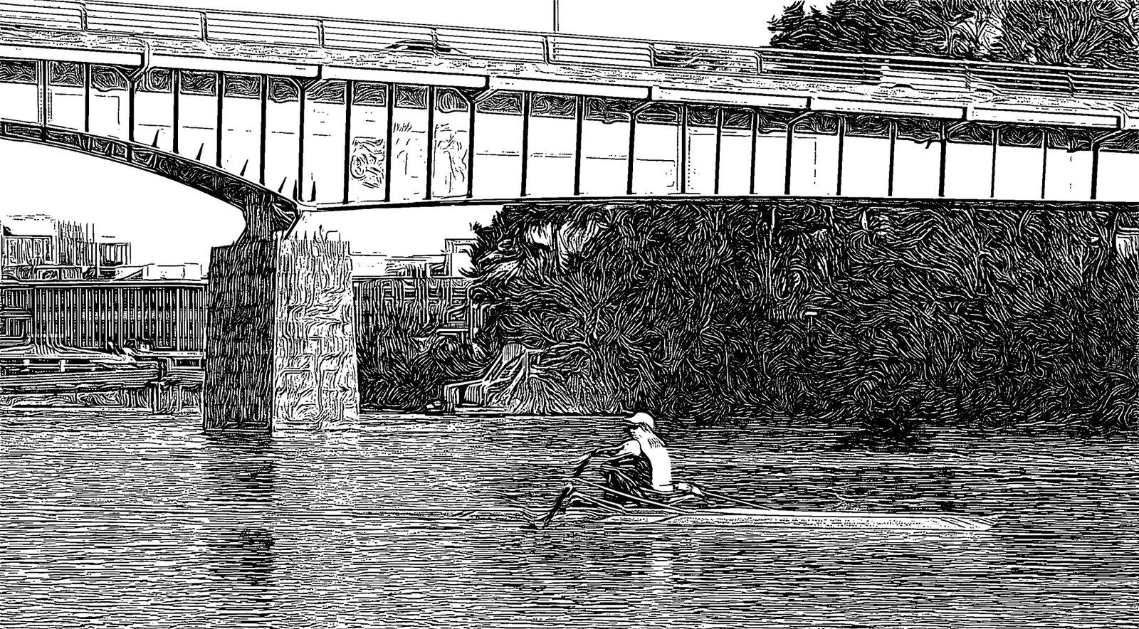 Rowers under a bridge.
