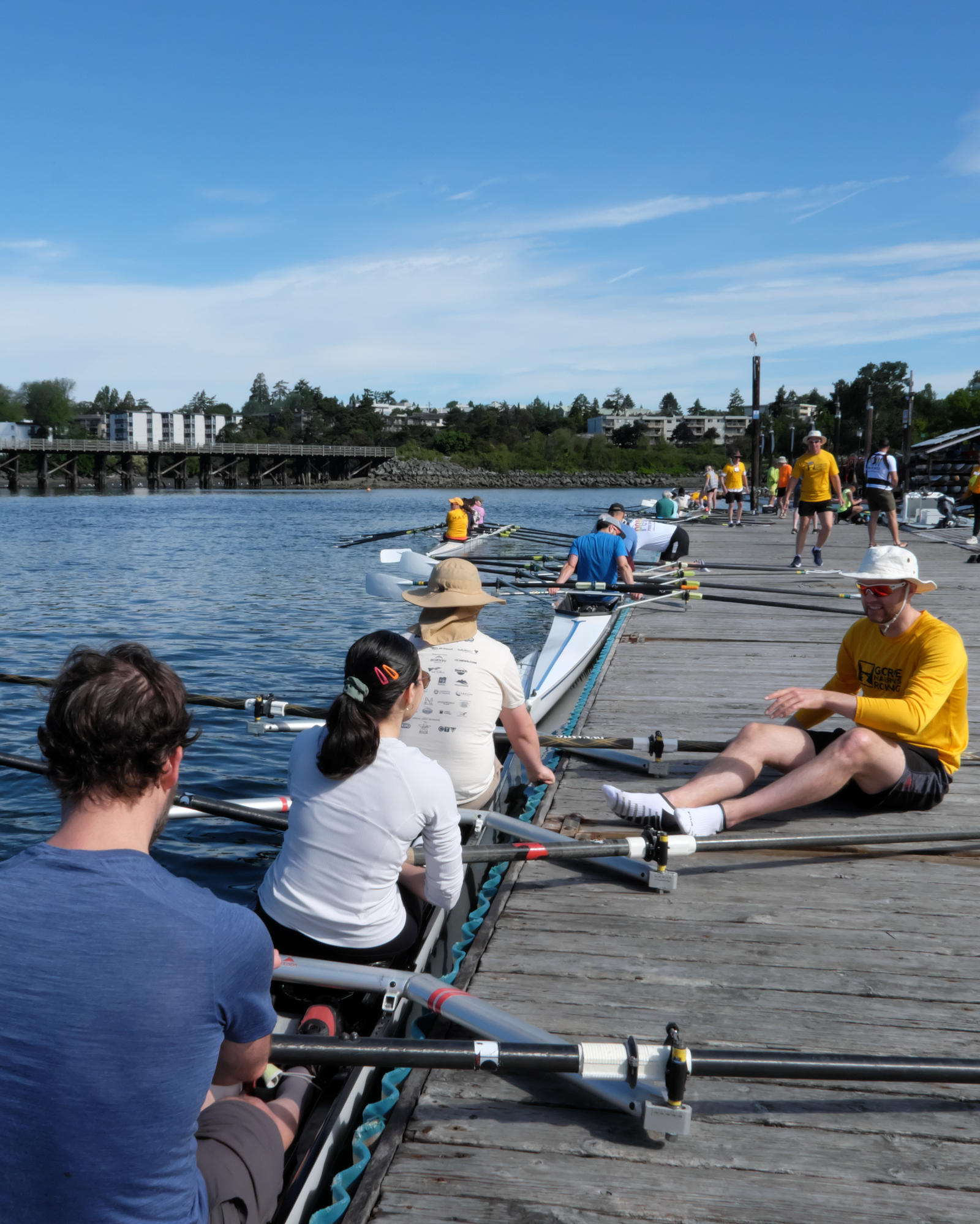 Rowers at the dock with a M.A.S.T. team member during a learn-to-row event.